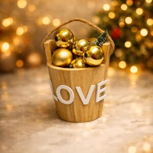 decorative wooden LOVE bucket with gold ornaments and warm background lights