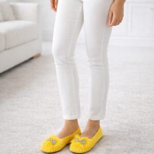 Sunshine Yellow crochet flats with faux-fur trim and butterfly brooch